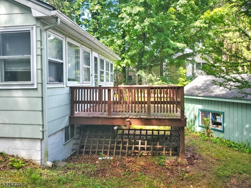 4 Village Place Oak Ridge, NJ 07438 - Photo 10 of 15 a view of a house with a deck