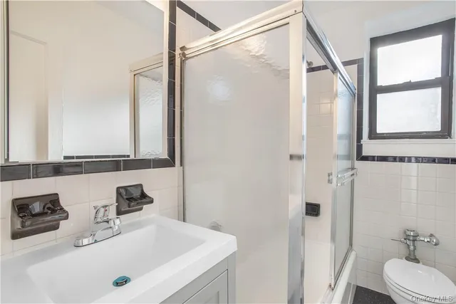 a bathroom with a tub and a sink