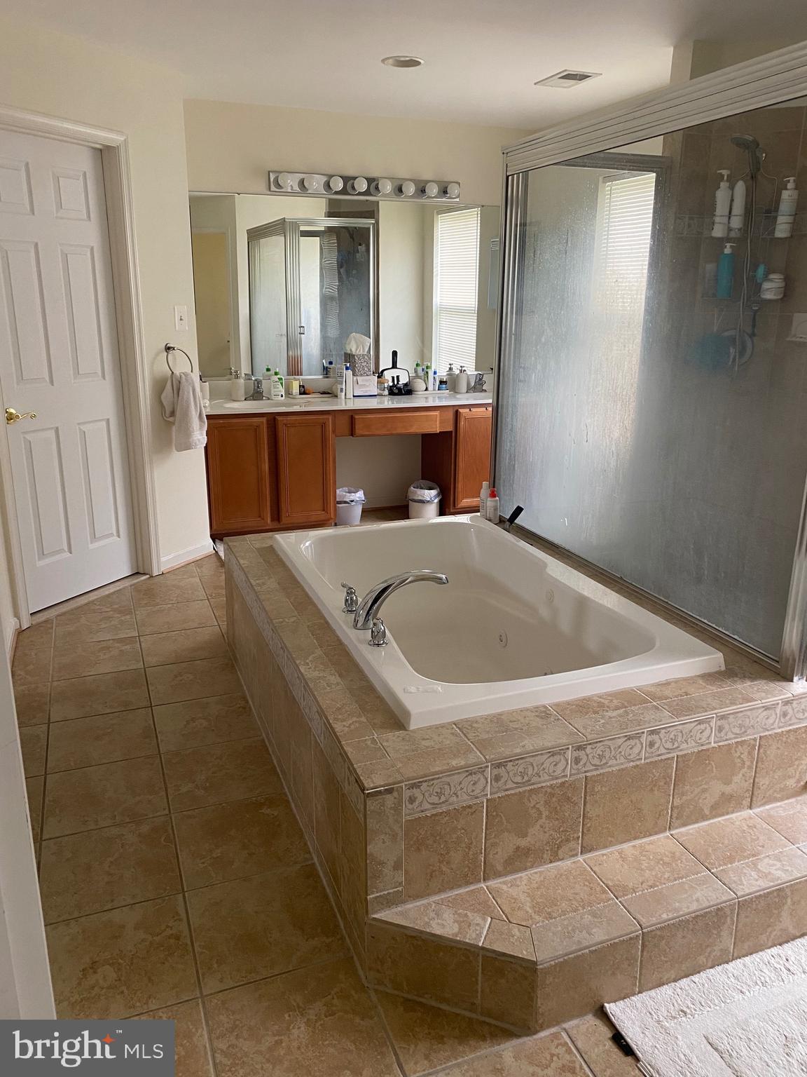 94 Rydal Circle Magnolia, DE 19962 - Photo 13 of 23 a bath tub sitting in a bathroom next to a window