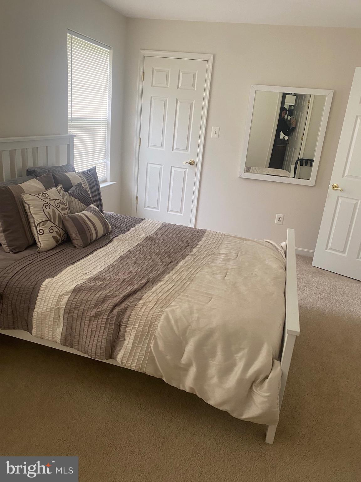 94 Rydal Circle Magnolia, DE 19962 - Photo 17 of 23 a large bed sitting in a bedroom next to a window