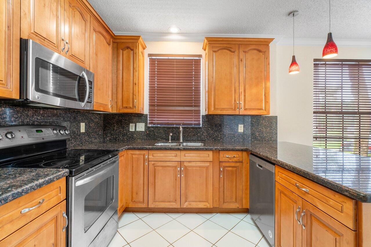6721 Montego Bay Boulevard, Unit E Boca Raton, FL 33433 - Photo 6 of 37 KITCHEN VIEW 2