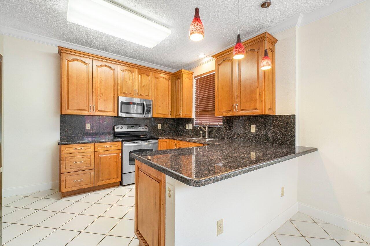 6721 Montego Bay Boulevard, Unit E Boca Raton, FL 33433 - Photo 8 of 37 KITCHEN VIEW 4