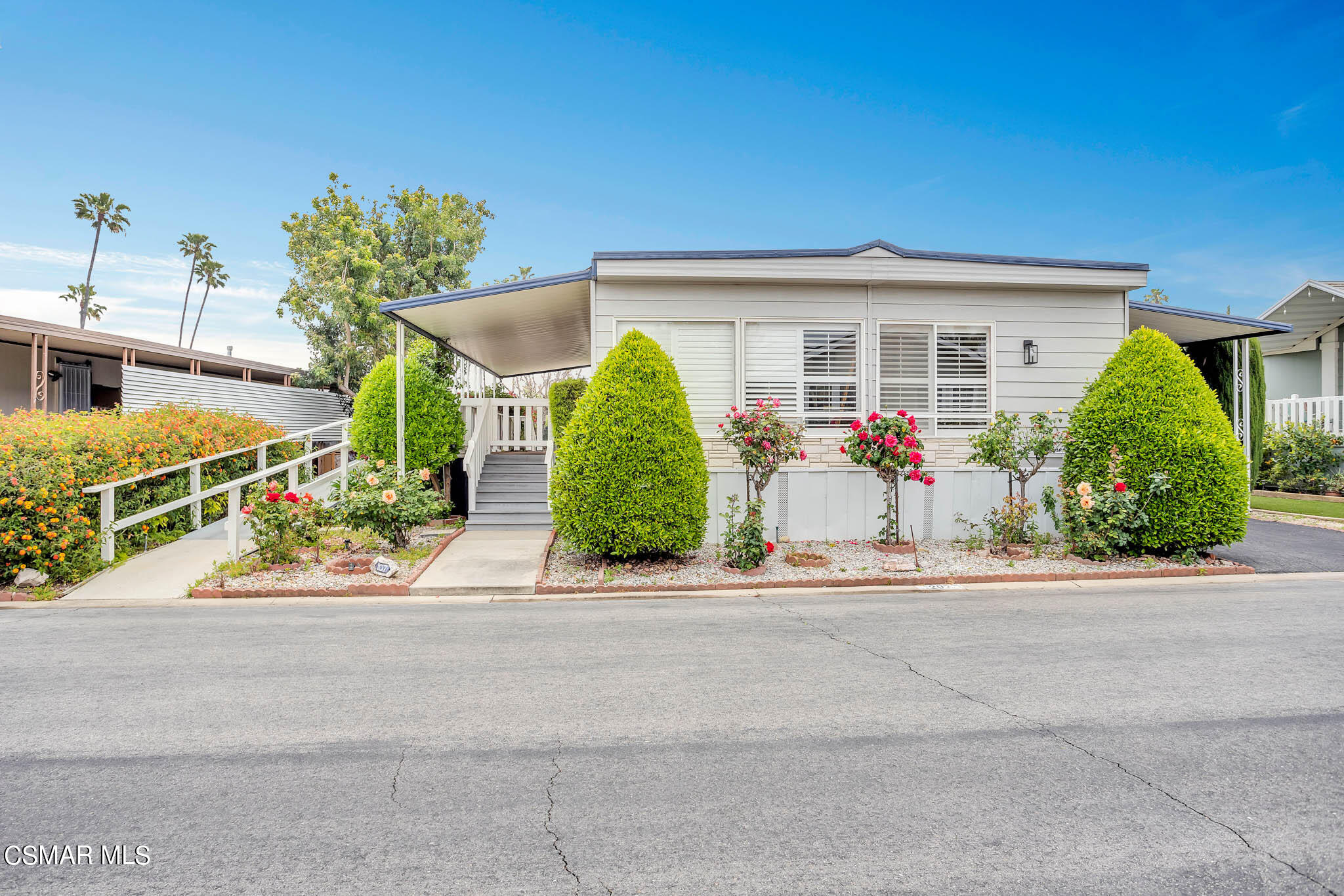 195 Tierra Rejada Road, Unit 207 Simi Valley, CA 93065 - Photo 1 of 43 front view of house with a yard