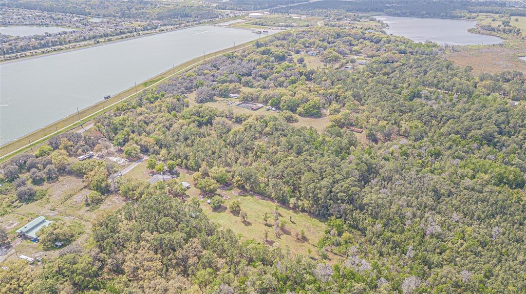 30651 Elam Road Wesley Chapel, FL 33545 - Photo 14 of 21 a view of a dry yard with wooden floor and fence