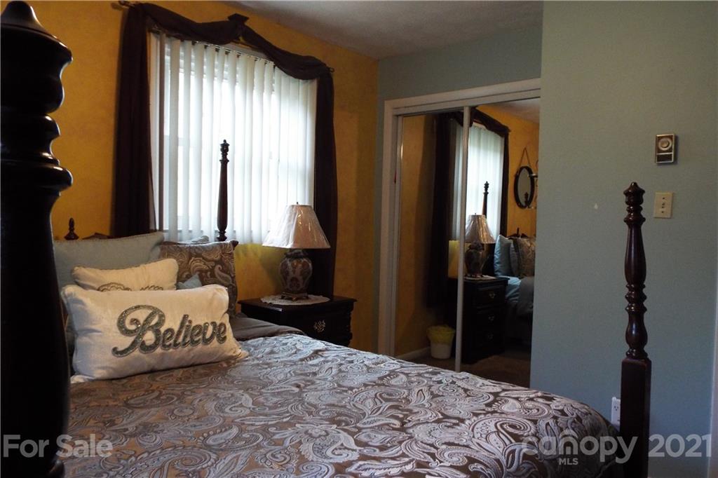 7905 Barkley Road Sherrills Ford, NC 28673 - Photo 16 of 31 a bedroom with a bed and a window