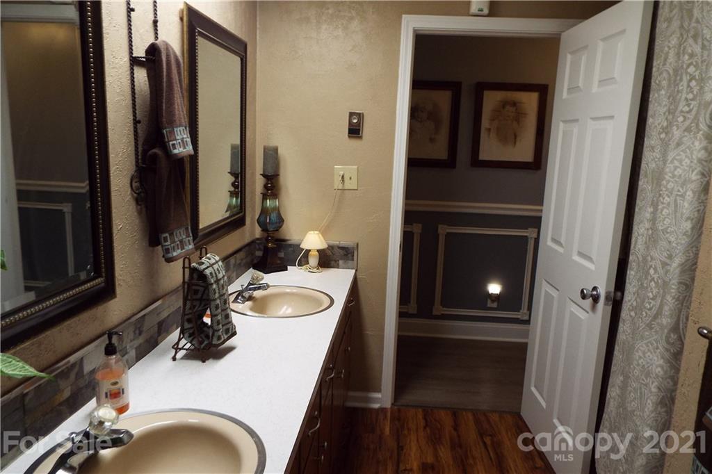 7905 Barkley Road Sherrills Ford, NC 28673 - Photo 18 of 31 a bathroom with a sink and a mirror