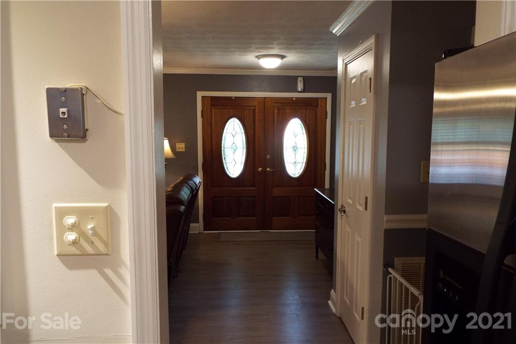 7905 Barkley Road Sherrills Ford, NC 28673 - Photo 3 of 31 a view of a hallway with wooden floor