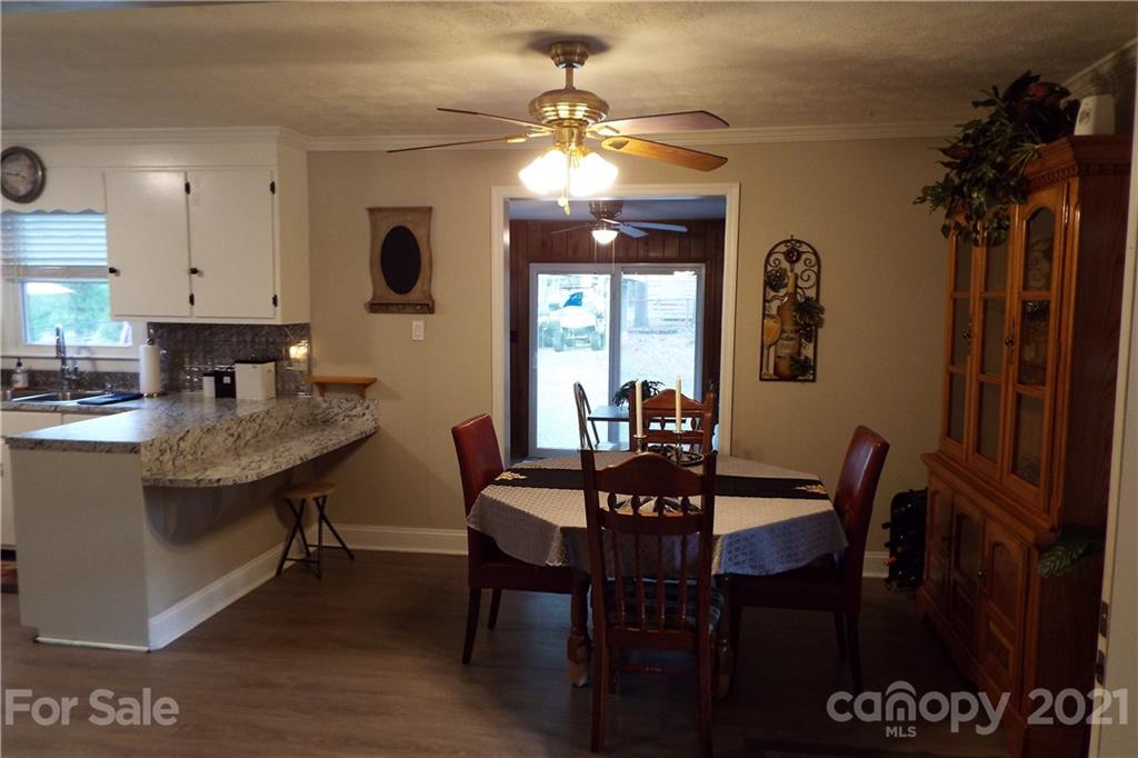 7905 Barkley Road Sherrills Ford, NC 28673 - Photo 8 of 31 a view of a a dining room with furniture and chandelier