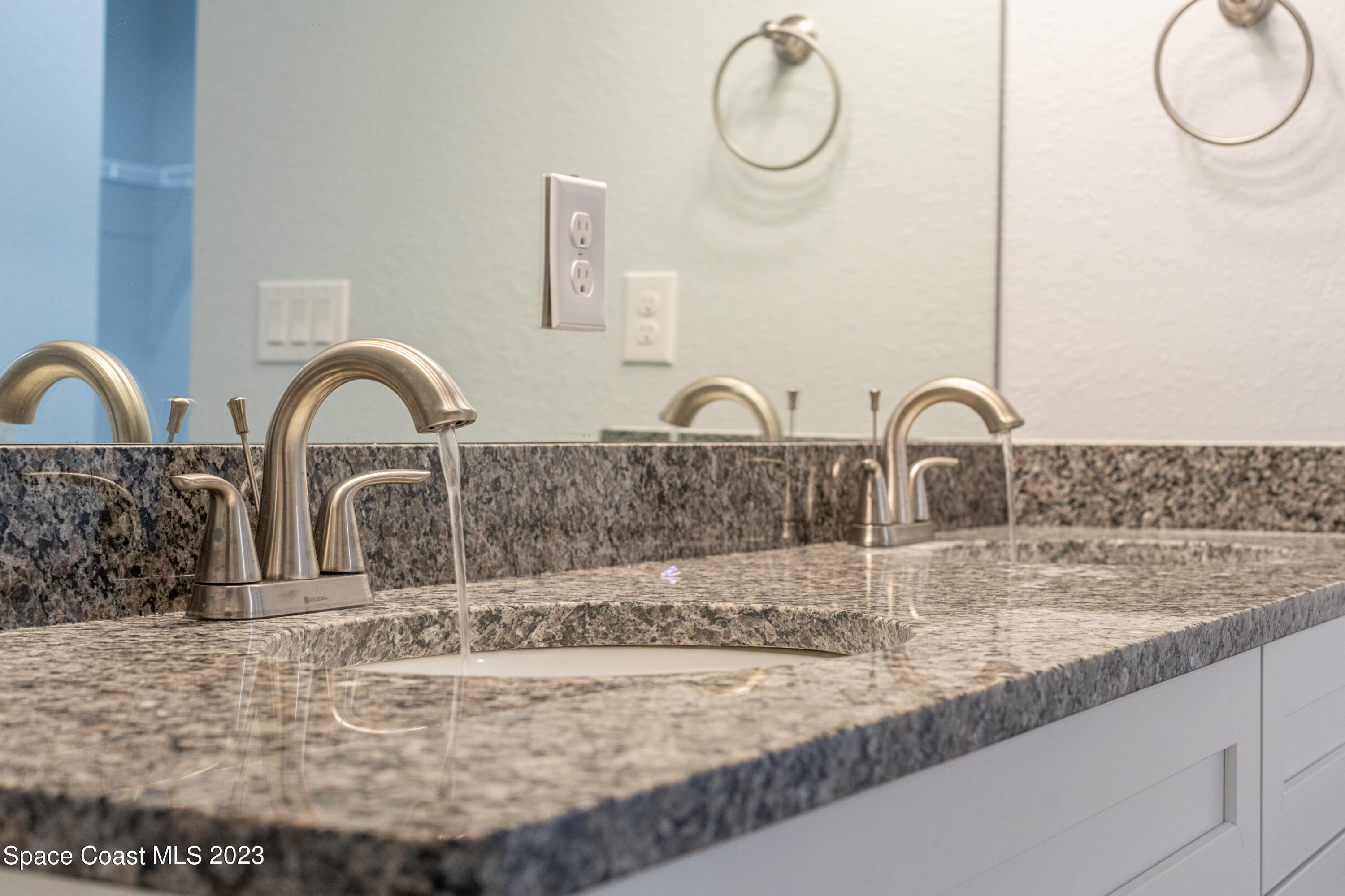 1289 Hastings Road Southwest Palm Bay, FL 32908 - Photo 26 of 38 a close view of a sink and tap