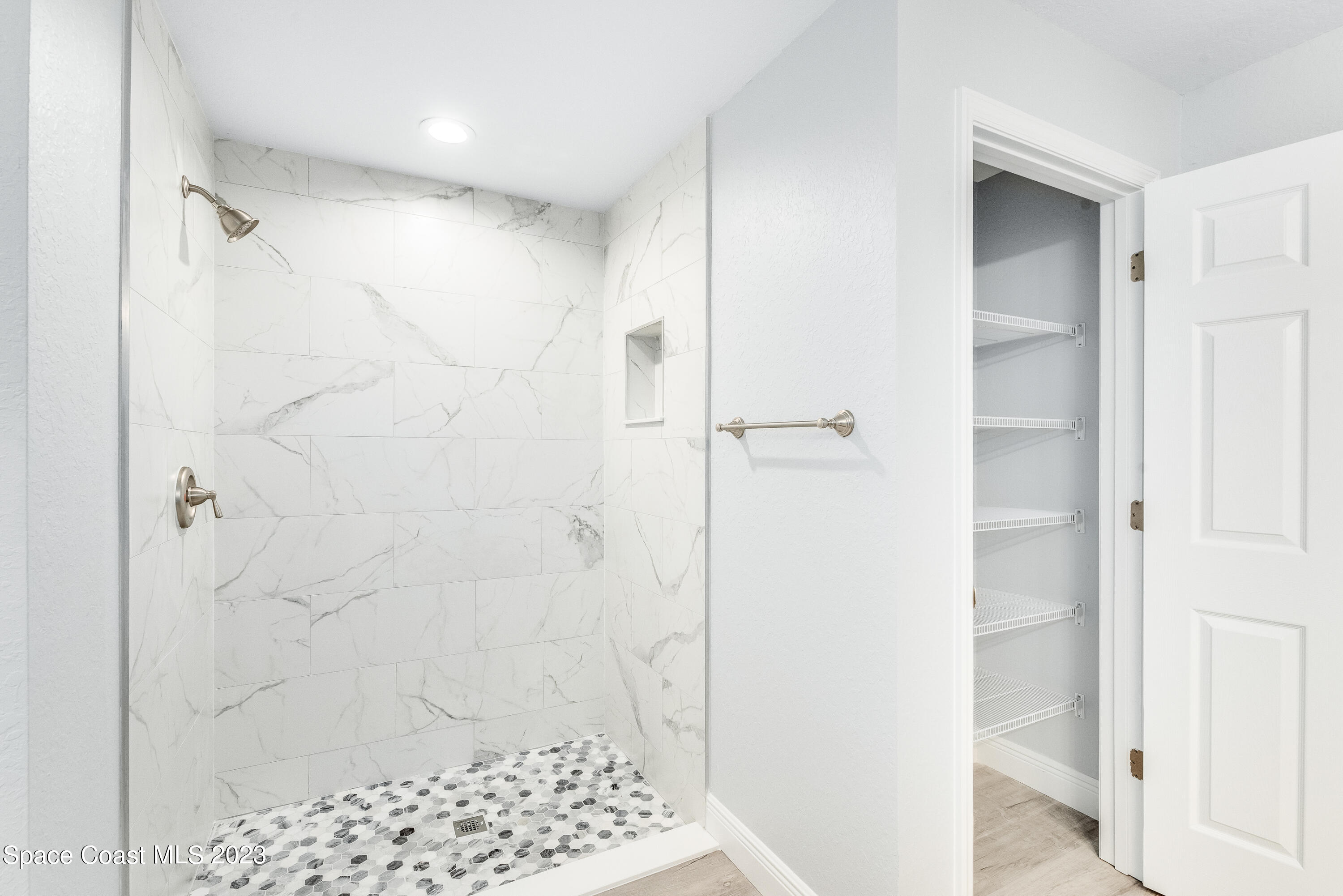 1289 Hastings Road Southwest Palm Bay, FL 32908 - Photo 27 of 38 a bathroom with a shower and a sink