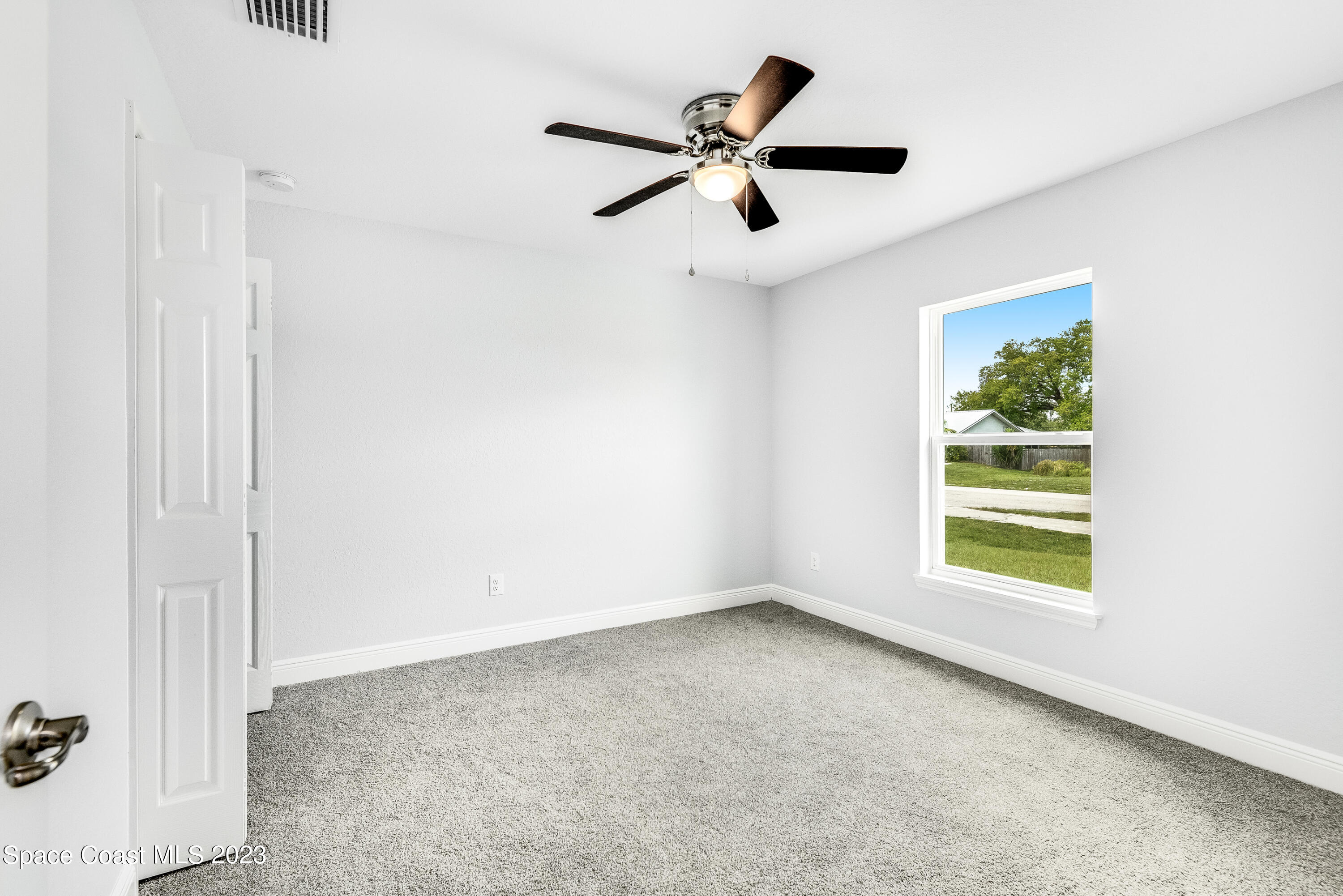 1289 Hastings Road Southwest Palm Bay, FL 32908 - Photo 29 of 38 a view of a ceiling fan and a window