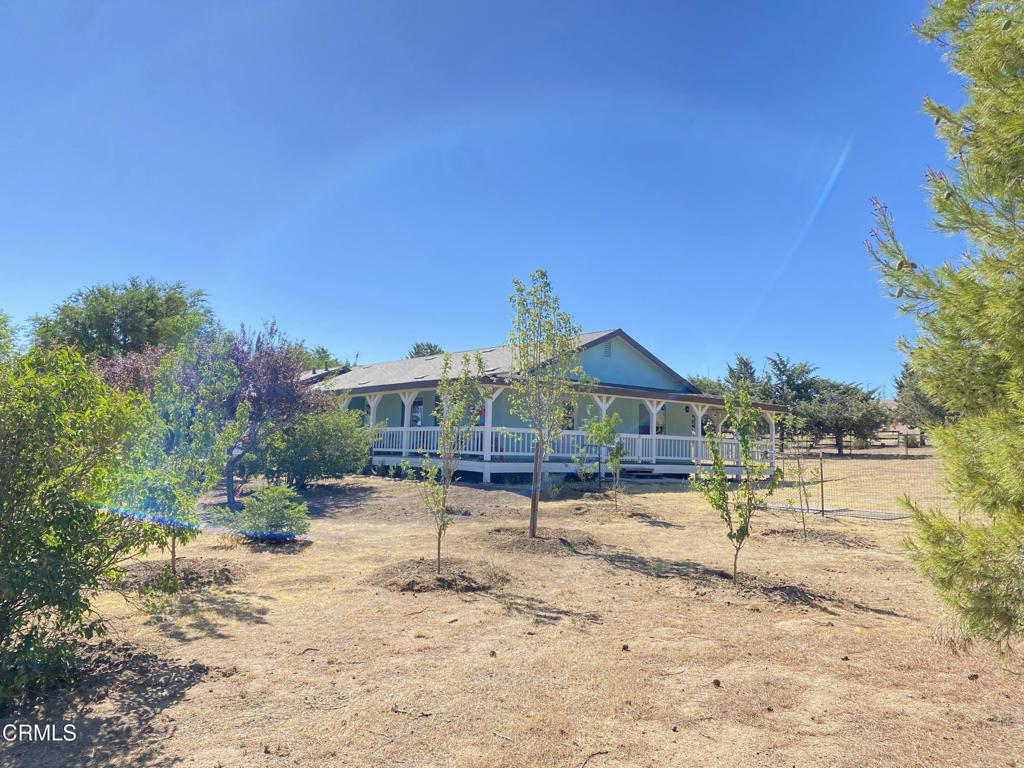 18300 Grant Place Tehachapi, CA 93561 - Photo 16 of 28 a view of a house with a yard