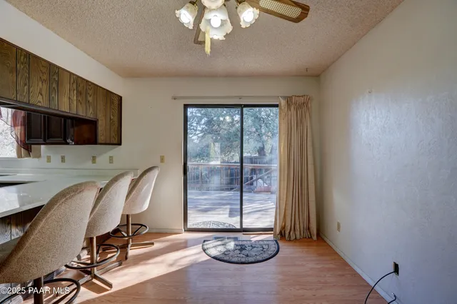 a kitchen with granite countertop a refrigerator and a sink