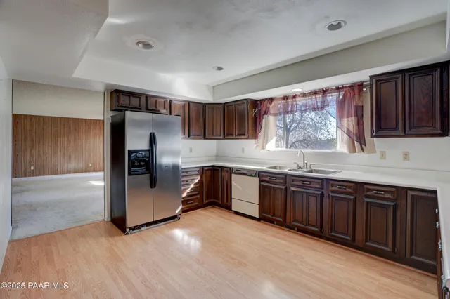 a view of empty room with a fireplace