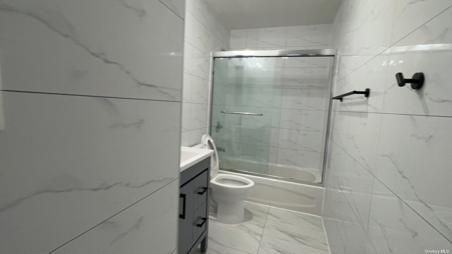 1821 Grove Street Queens, NY 11385 - Photo 18 of 30 a bathroom with a shower