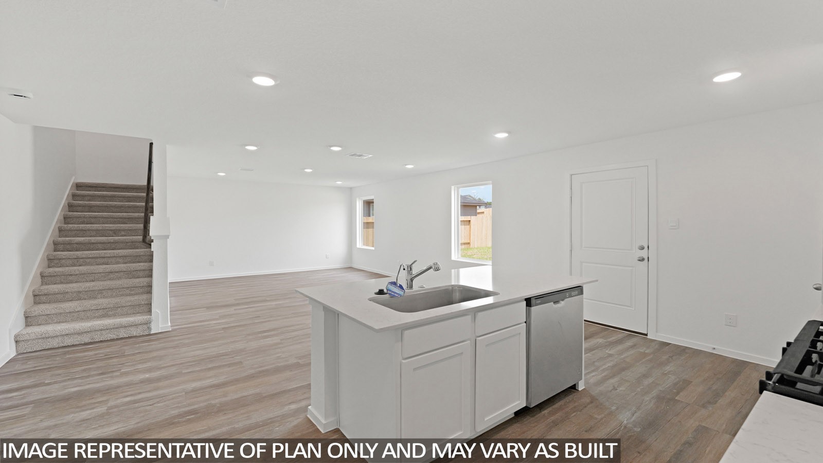 22706 Ravine Edge Court Hockley, TX 77447 - Photo 2 of 19 a room with a table chairs and wooden floor