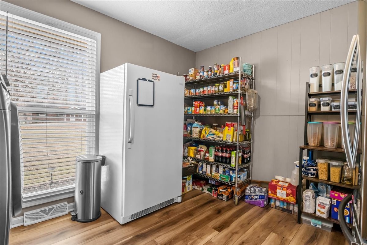 140 Mockingbird Street Erin, TN 37061 - Photo 16 of 36 a view of a livingroom with furniture and an empty shelves