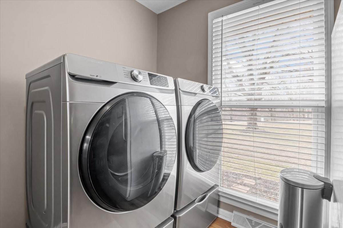 140 Mockingbird Street Erin, TN 37061 - Photo 17 of 36 a utility room with dryer and washer