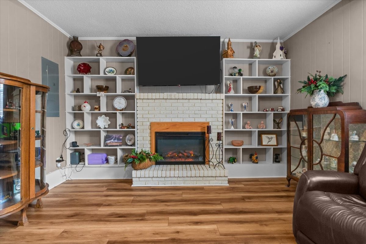 140 Mockingbird Street Erin, TN 37061 - Photo 20 of 36 a living room with furniture and a fireplace