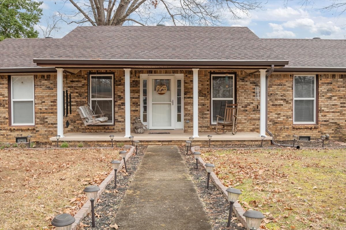 140 Mockingbird Street Erin, TN 37061 - Photo 2 of 36 front view of a brick house with a window