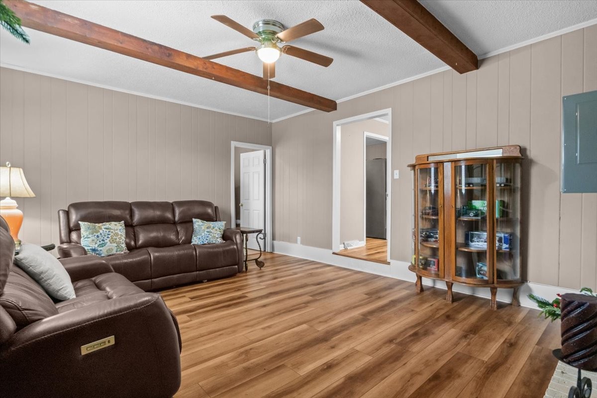 140 Mockingbird Street Erin, TN 37061 - Photo 22 of 36 a living room with furniture and a wooden floor