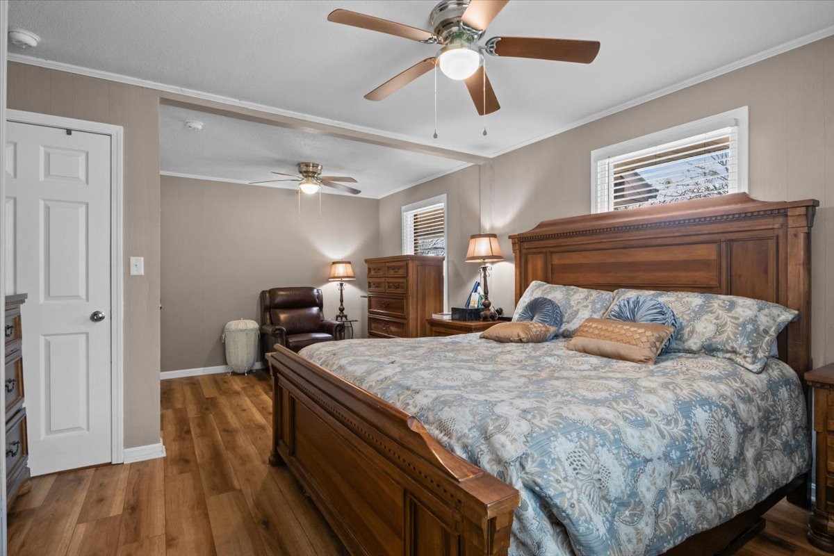 140 Mockingbird Street Erin, TN 37061 - Photo 25 of 36 a bedroom with a bed and wooden floor