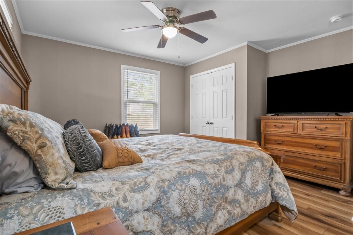 140 Mockingbird Street Erin, TN 37061 - Photo 27 of 36 a bedroom with a bed and a flat screen tv