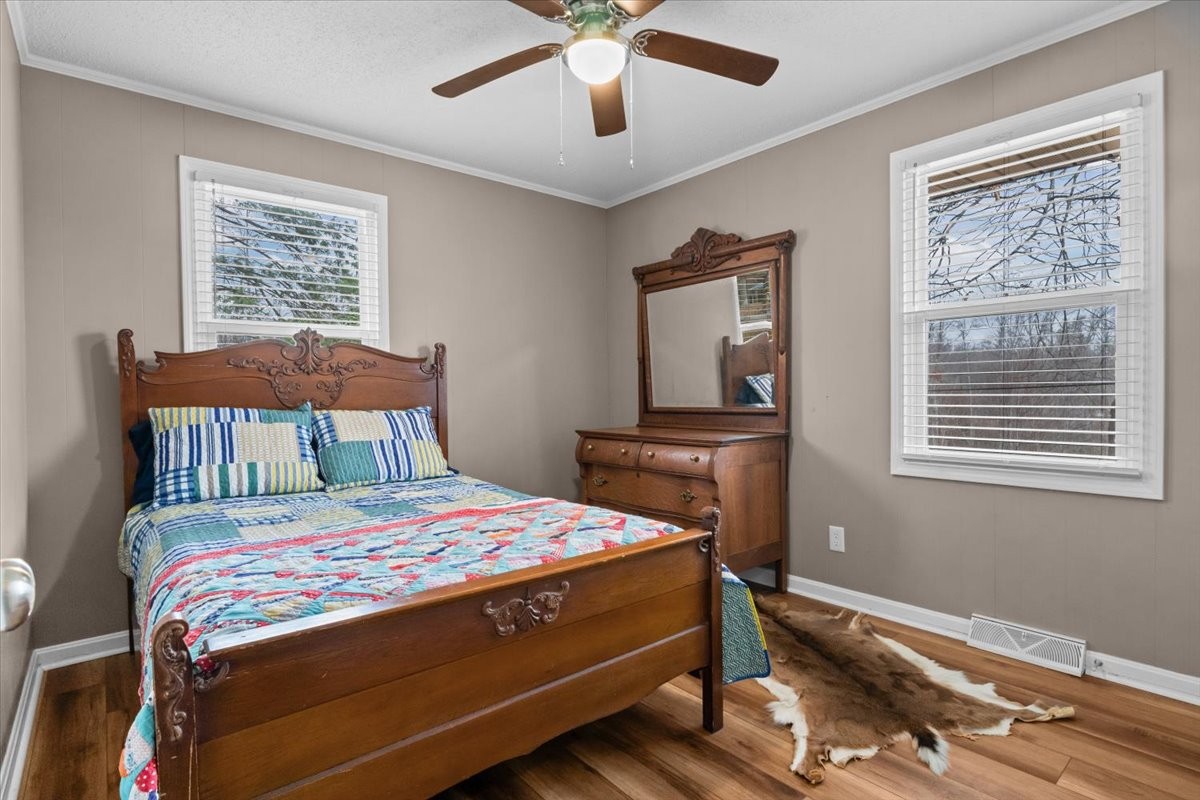 140 Mockingbird Street Erin, TN 37061 - Photo 29 of 36 a bedroom with a bed and a window