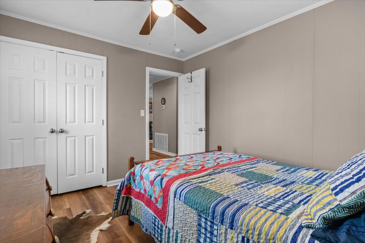 140 Mockingbird Street Erin, TN 37061 - Photo 30 of 36 a bedroom with a bed and a window