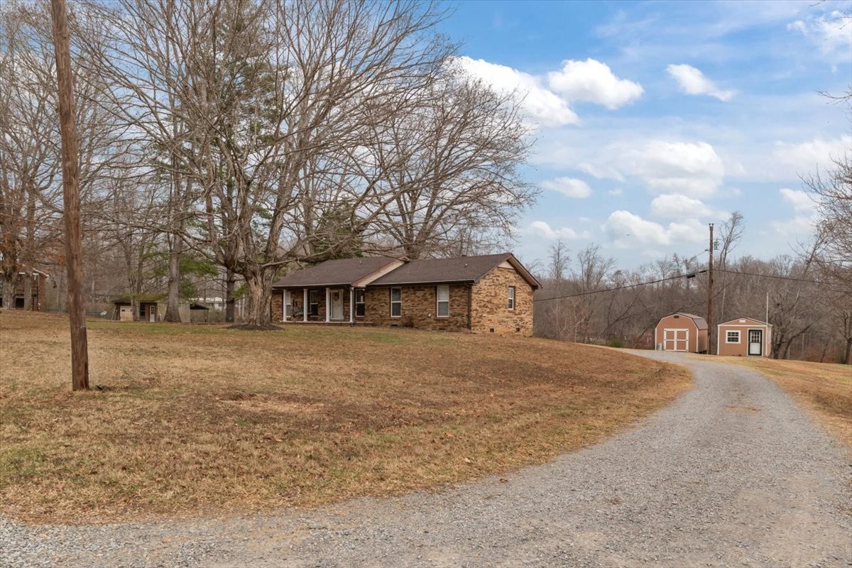 140 Mockingbird Street Erin, TN 37061 - Photo 6 of 36 a view of a house with a yard