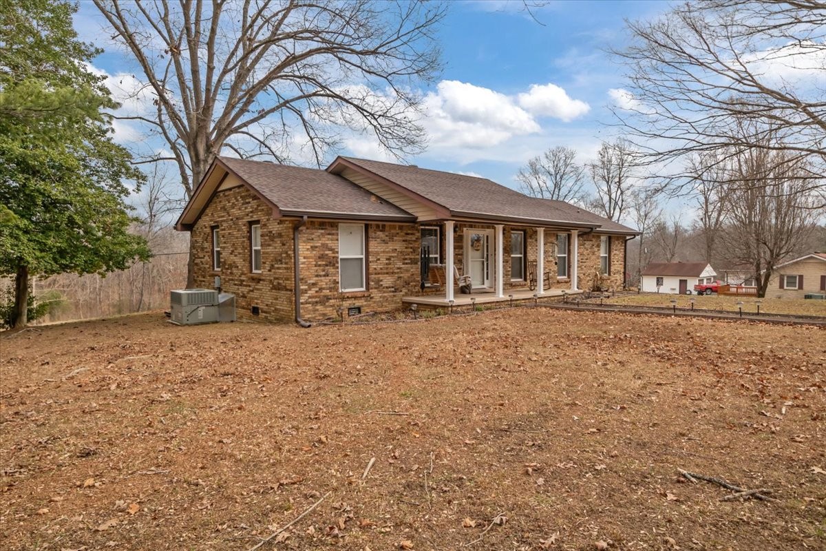 140 Mockingbird Street Erin, TN 37061 - Photo 7 of 36 a front view of a house with a yard