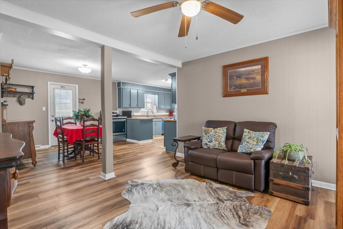 140 Mockingbird Street Erin, TN 37061 - Photo 8 of 36 a living room with furniture and wooden floor