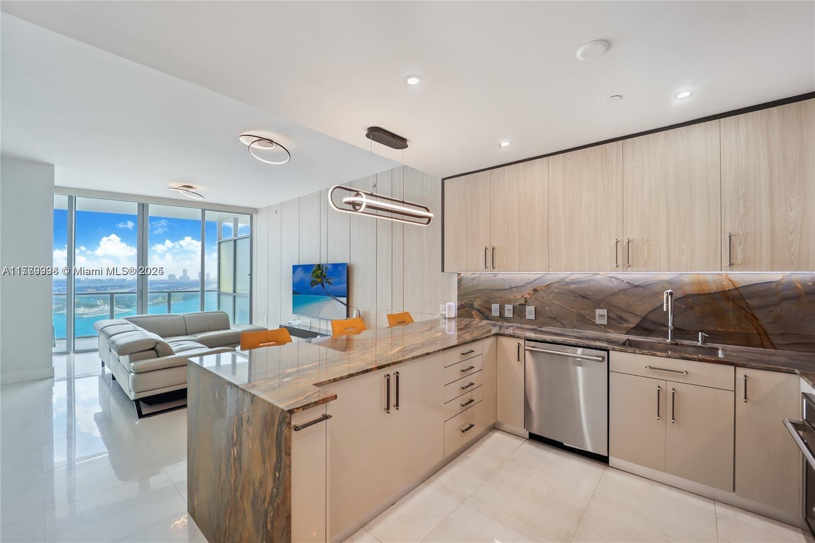 a kitchen that has a sink and a stove in it
