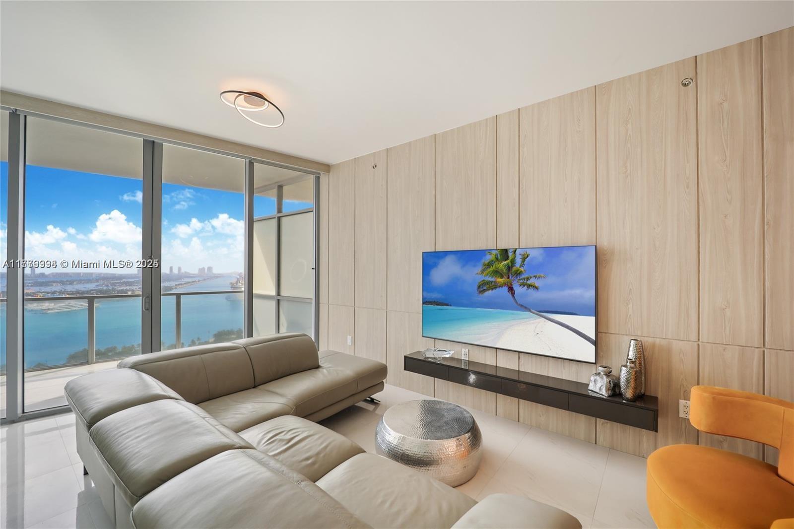 1100 Biscayne Boulevard, Unit 3004 Miami, FL 33132 - Photo 4 of 15 a living room with furniture