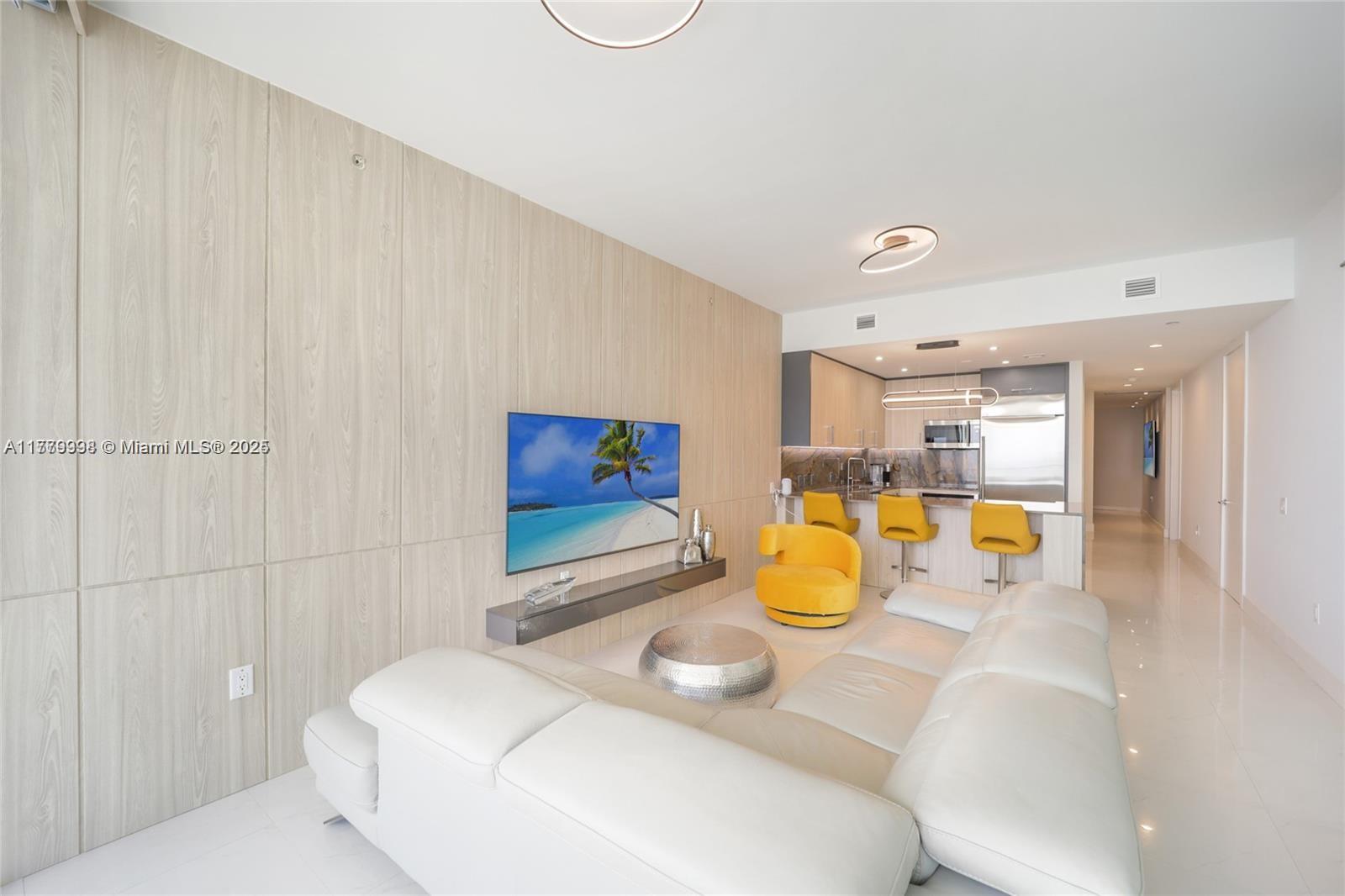 1100 Biscayne Boulevard, Unit 3004 Miami, FL 33132 - Photo 5 of 15 a bathroom with a sink mirror and vanity