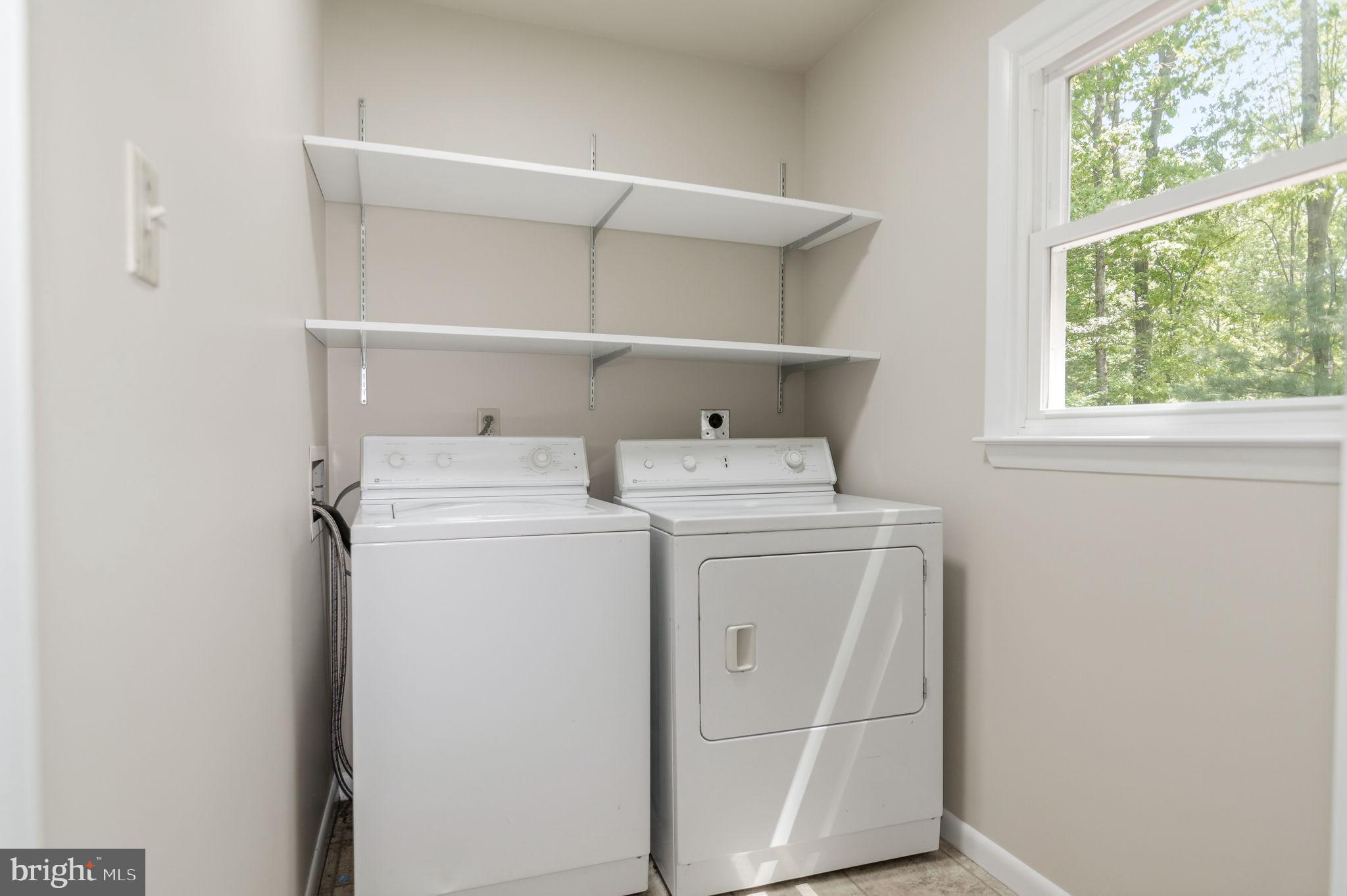 13593 Bethel Road Manassas, VA 20112 - Photo 22 of 54 Full sized laundry room with a washer & dryer