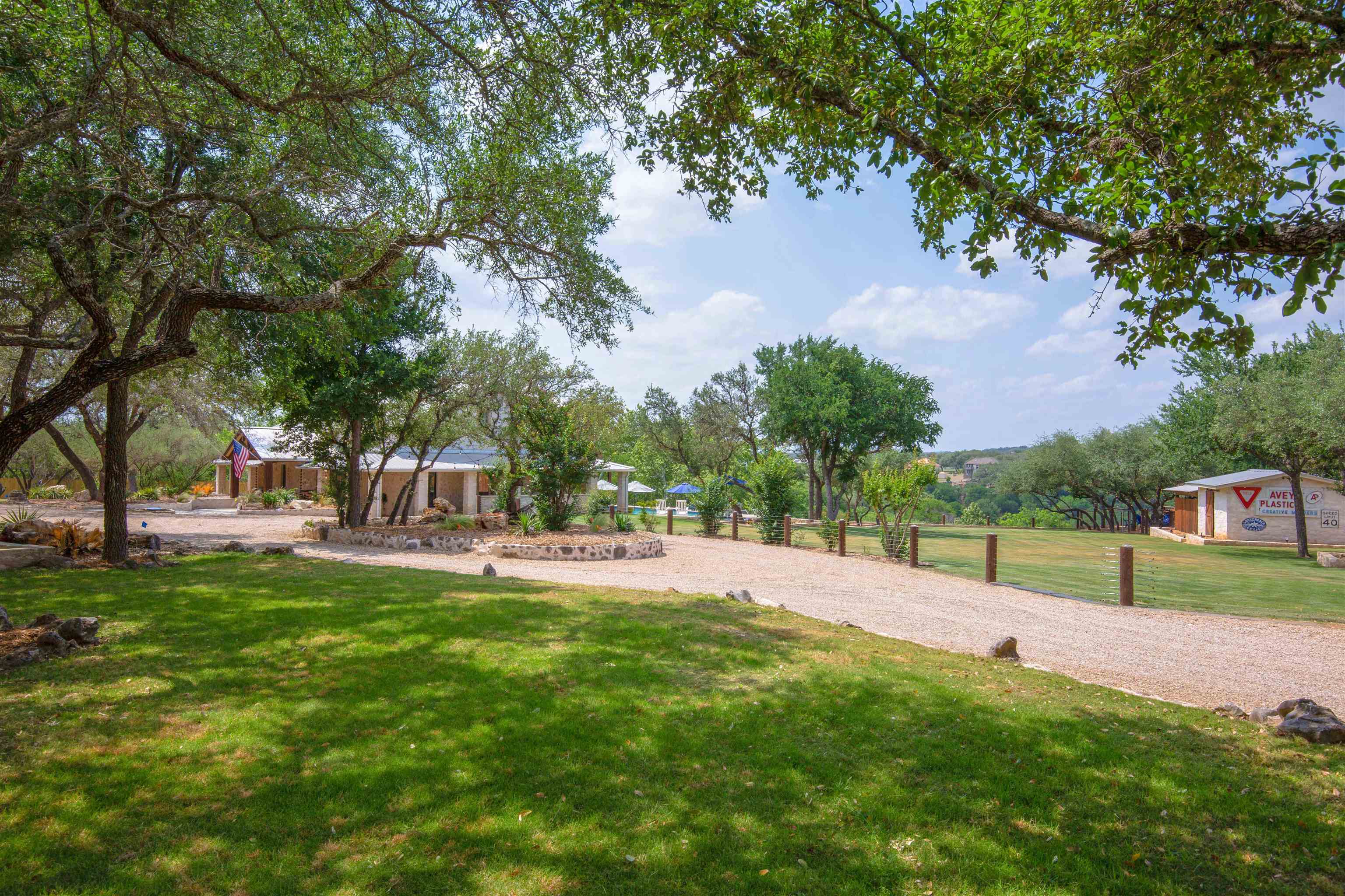 3114 Pace Bend Road South Spicewood, TX 78669 - Photo 1 of 1 a view of a park with large trees