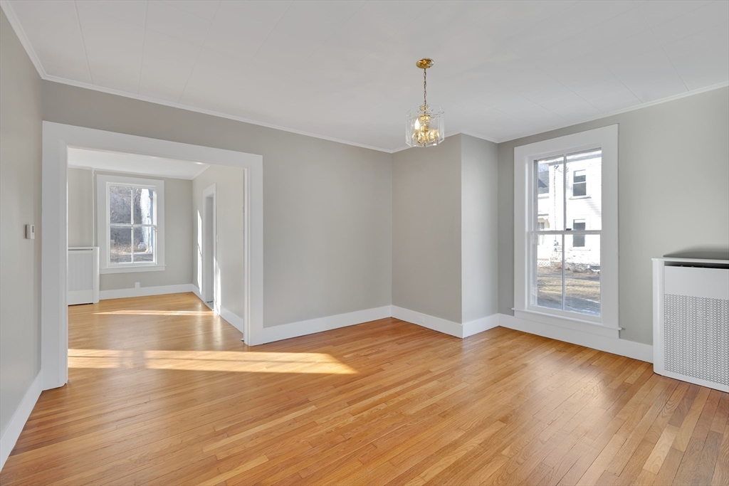 24 Flynt Avenue Monson, MA 01057 - Photo 13 of 29 an empty room with wooden floor and windows