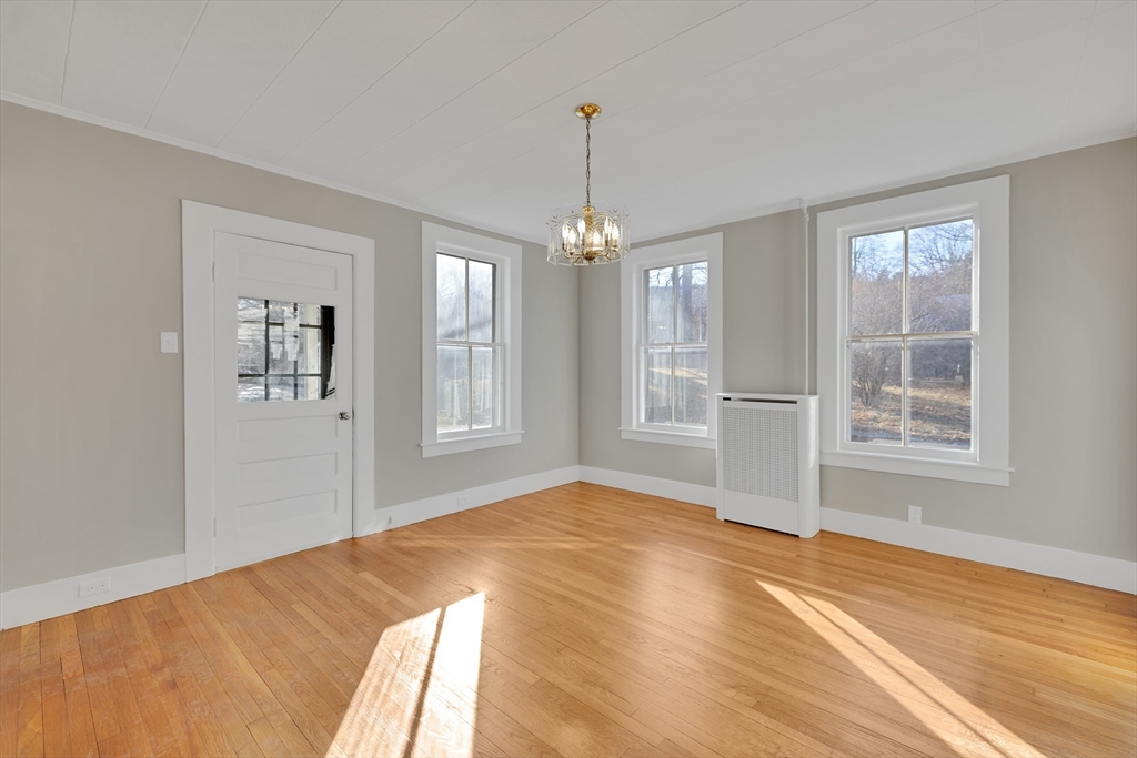 24 Flynt Avenue Monson, MA 01057 - Photo 14 of 29 a view of an empty room with window and hardwood floor