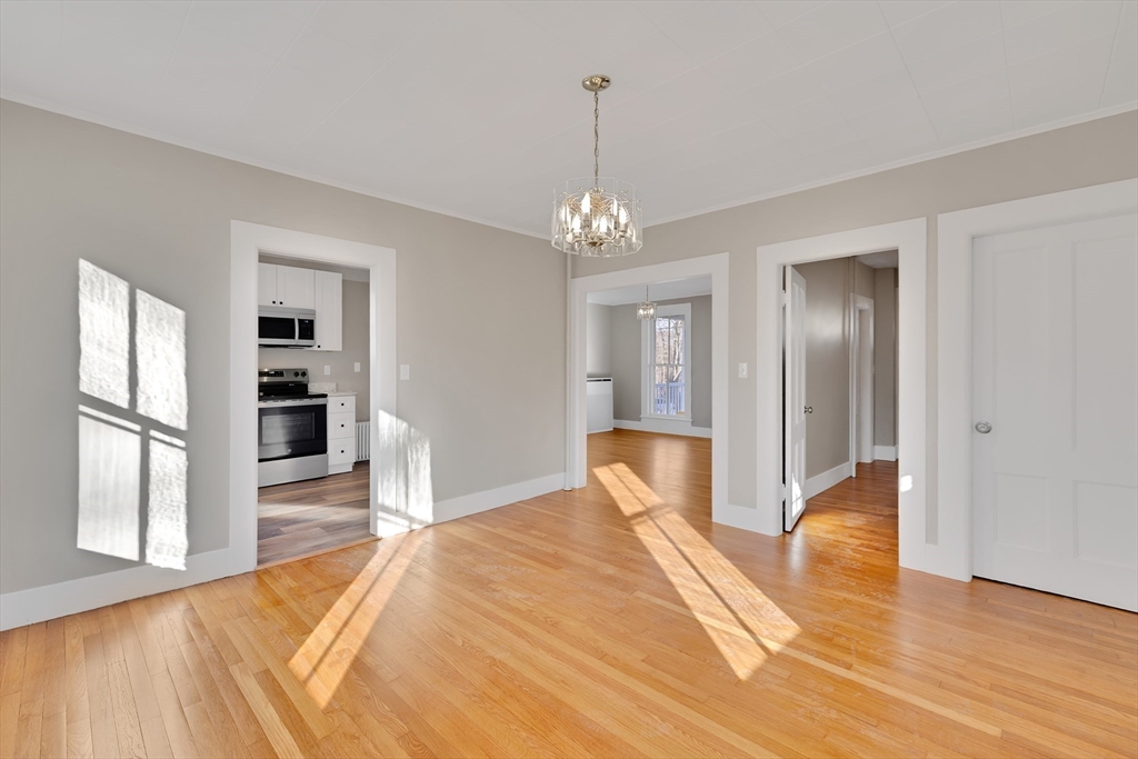 24 Flynt Avenue Monson, MA 01057 - Photo 15 of 29 a bedroom with a bed and a chandelier