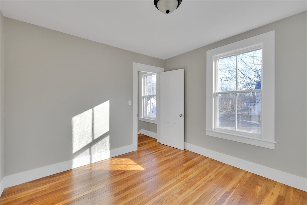 24 Flynt Avenue Monson, MA 01057 - Photo 23 of 29 a view of an empty room with wooden floor and a window