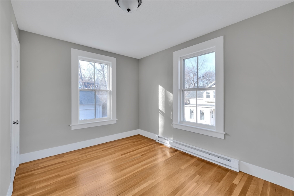 24 Flynt Avenue Monson, MA 01057 - Photo 24 of 29 an empty room with wooden floor and windows