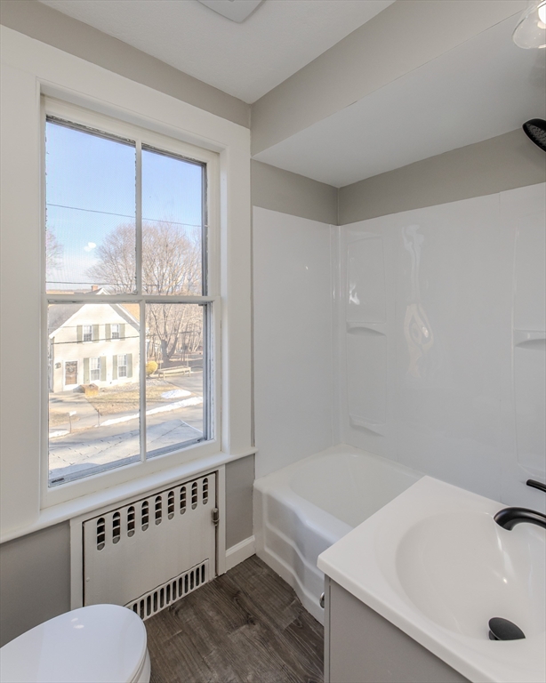 24 Flynt Avenue Monson, MA 01057 - Photo 26 of 29 a bathroom with a tub a sink and a window