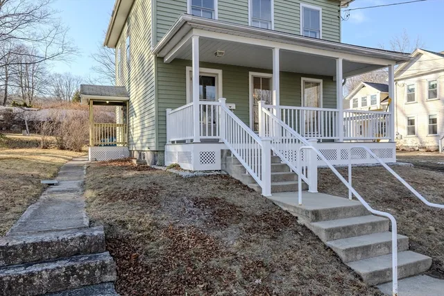 front view of a house with a yard