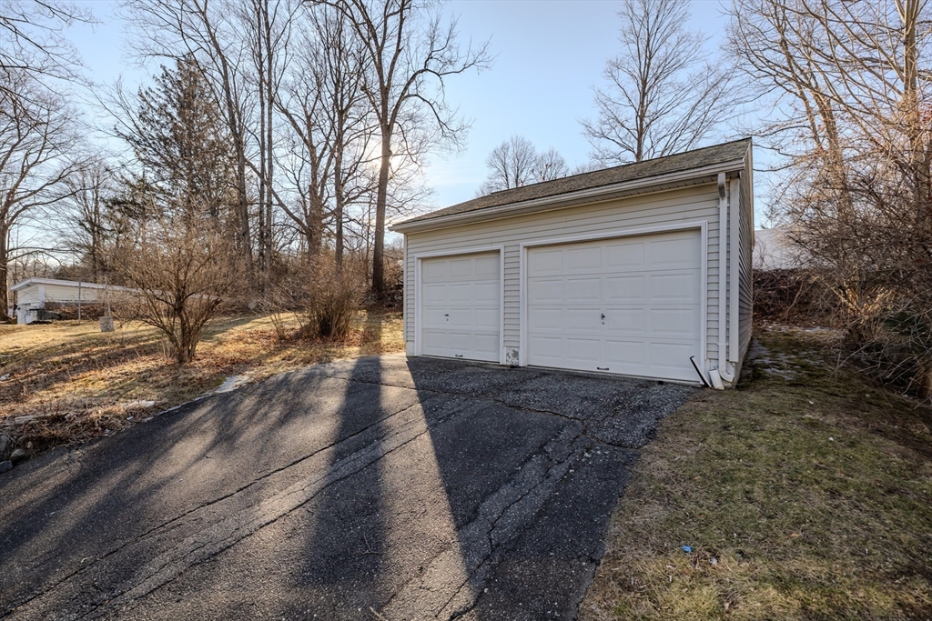24 Flynt Avenue Monson, MA 01057 - Photo 8 of 29 a view of a yard with a large tree