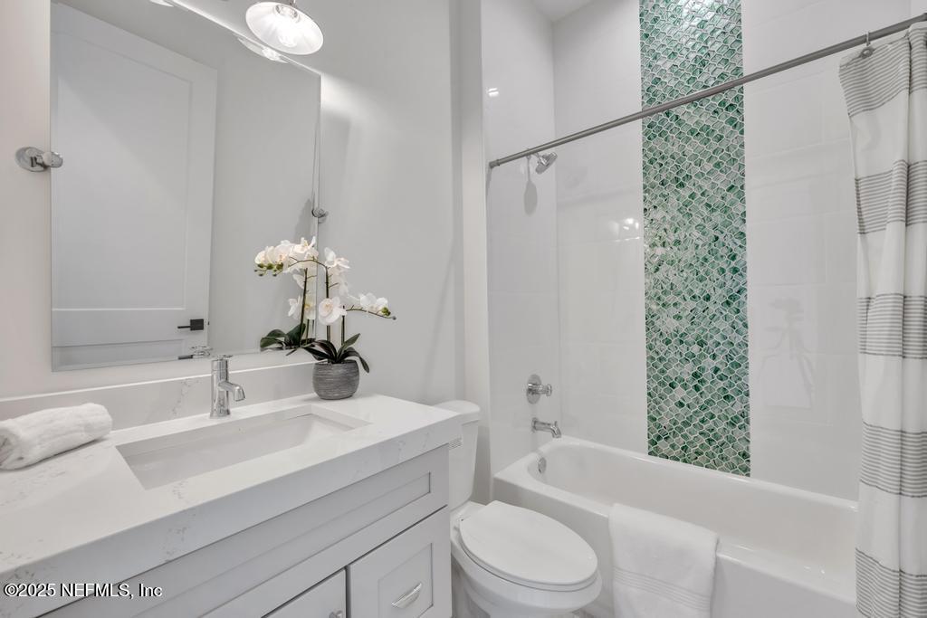 8515 Florence Cove Road St. Augustine, FL 32092 - Photo 14 of 16 a bathroom with a sink a toilet and shower