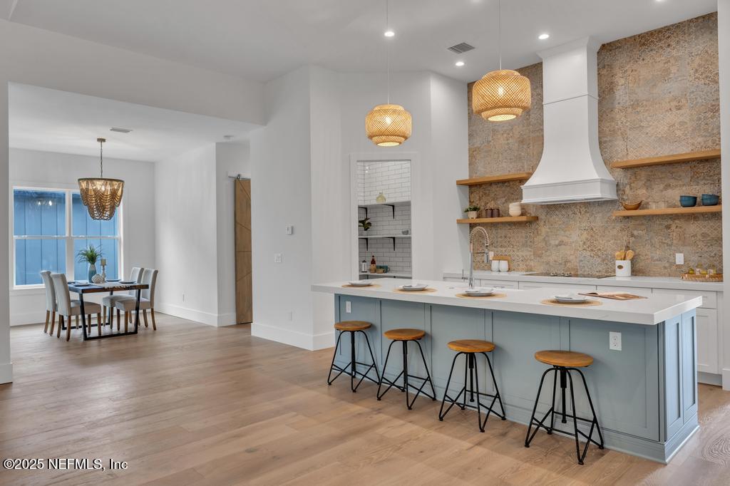 8515 Florence Cove Road St. Augustine, FL 32092 - Photo 6 of 16 a kitchen with a sink and chairs