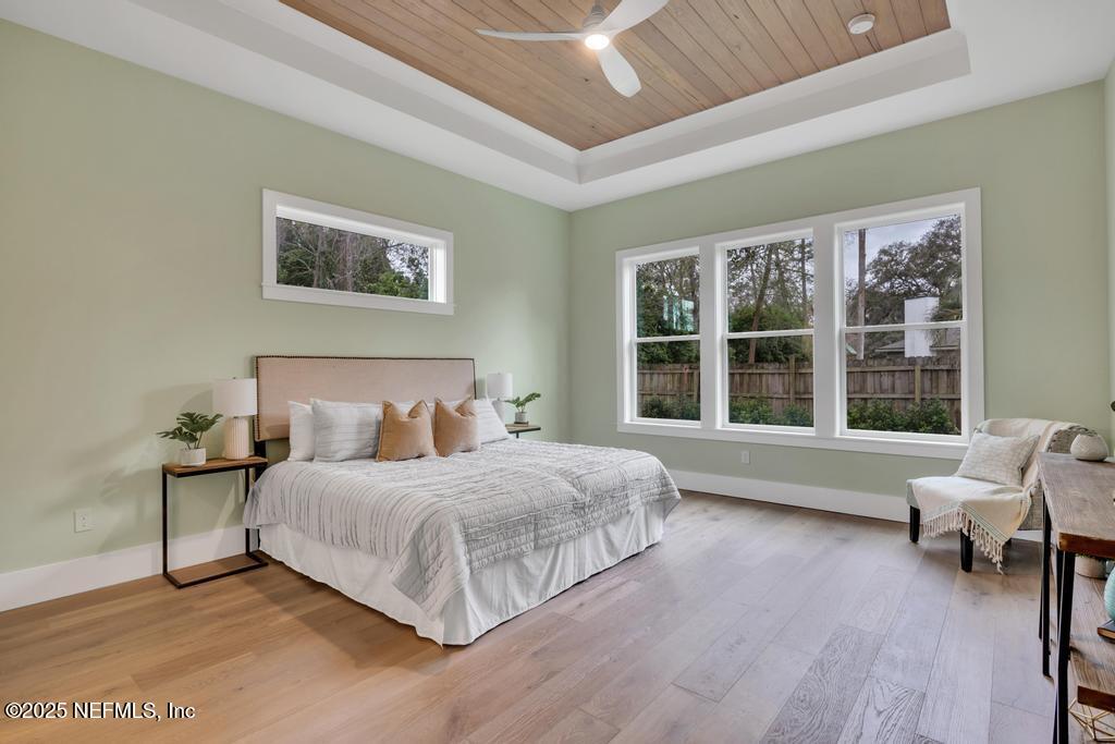 8515 Florence Cove Road St. Augustine, FL 32092 - Photo 9 of 16 a bedroom with a bed and a large window