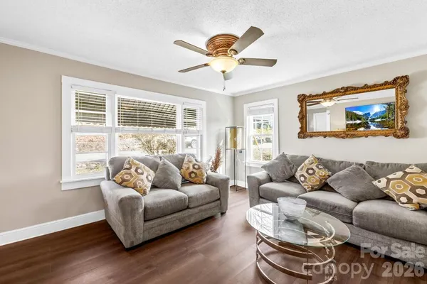 a living room with furniture and a large window