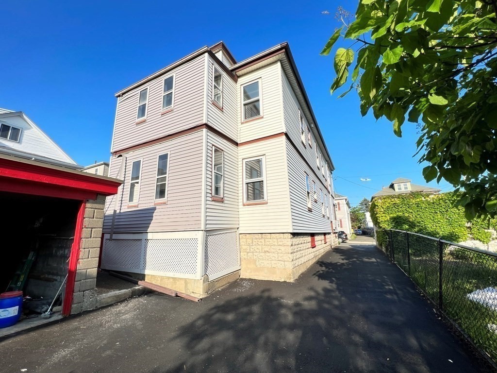 25 Teragram Street, Unit 1 Boston, MA 02128 - Photo 21 of 21 a view of house with backyard